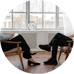 Two people in a therapy session in the Old City office